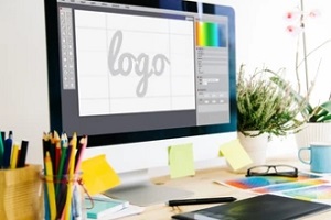 people designing logo on imac